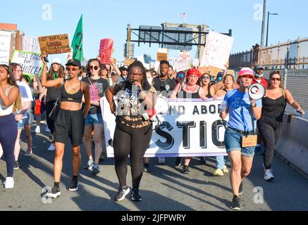 New York, United States. 04th July, 2022. Various activist groups gathered at Cadman Plaza and marched over Brooklyn Bridge in New York City to demand justice for abortion, environment, black lives on July 4, 2022. (Photo by Ryan Rahman/Pacific Press) Credit: Pacific Press Media Production Corp./Alamy Live News Stock Photo