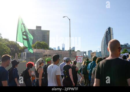 New York, United States. 04th July, 2022. Activists marching over Brooklyn Bridge to demand reproductive rights for all, on July 4, 2022. (Photo by Ryan Rahman/Pacific Press) Credit: Pacific Press Media Production Corp./Alamy Live News Stock Photo