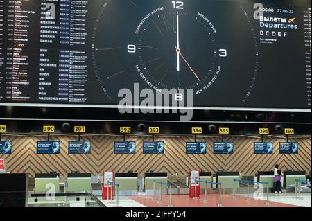 MOSCOW, RUSSIA - JULY 08, 2022: Sheremetyevo airport. flight information monitors and check-in in Sheremetyevo. airport check-in area Stock Photo