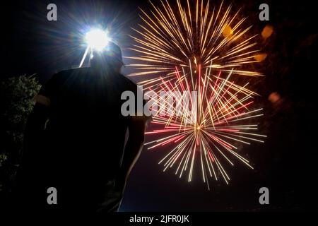 Los Angeles, California, USA. 4th July, 2022. Spectators gather near Rosemead Park to watch fireworks during the Fourth of July fireworks display in Rosemead, Calif. Monday, July 4, 2022. (Credit Image: © Ringo Chiu/ZUMA Press Wire) Stock Photo