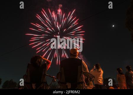 Los Angeles, California, USA. 4th July, 2022. Spectators gather near Rosemead Park to watch fireworks during the Fourth of July fireworks display in Rosemead, Calif. Monday, July 4, 2022. (Credit Image: © Ringo Chiu/ZUMA Press Wire) Stock Photo