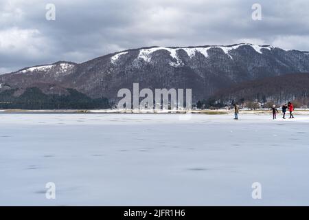 Laceno, Campania, Italy, Feb. 2022. Frozen surface of Laceno Lake during winter Stock Photo