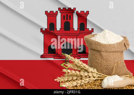 Gibraltar grain crisis, Concept global hunger crisis,  On background Flag Gibraltar wheat grain. Concept of growing wheat in Russia Stock Photo