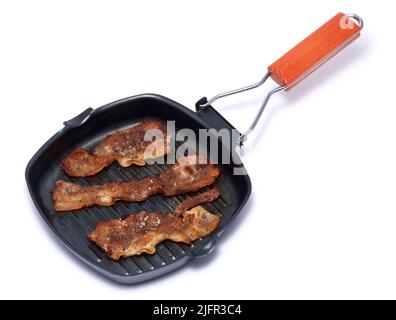 Frying pan with cooked bacon rashers on white background Stock Photo - Alamy