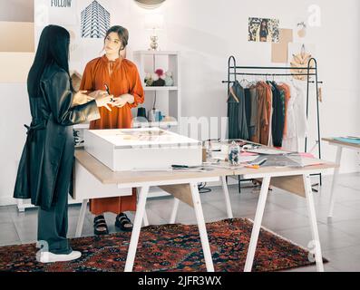 This is my vision. Shot of two young businesswomen talking at work. Stock Photo