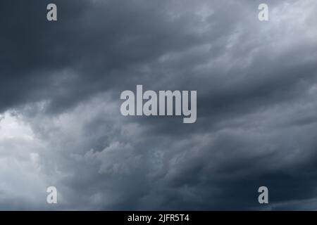 Cumulonimbus cloud formations on tropical blue sky , Nimbus moving , Abstract background from natural phenomenon and gray clouds hunk , Thailand Stock Photo