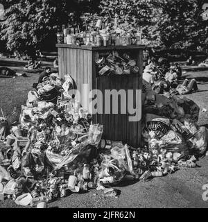 Rubbish piles up in a park in London during the good weather spell. Stock Photo