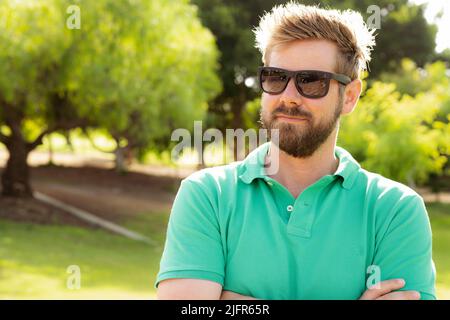 Close up portrait of a handsome young man wearing sunglasses outdoor Stock Photo
