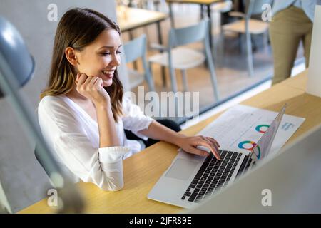 Portrait of happy smiling businesswoman working in office or from home Stock Photo
