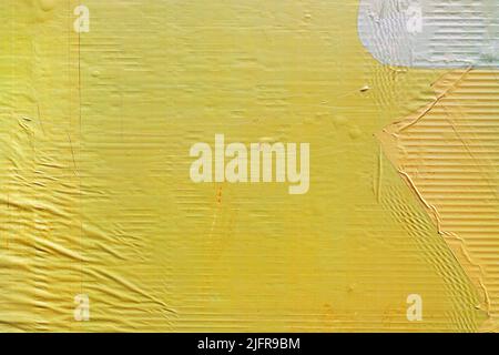 Texture of yellow glued advertising poster paper as urban background, worn ad banner surface Stock Photo