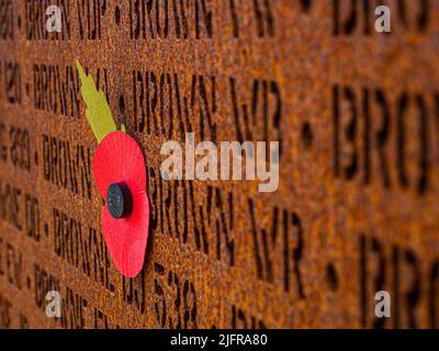Poppy on the memorial to the 57,000 men who lost their lives during WW2 as part of bomber command. Stock Photo