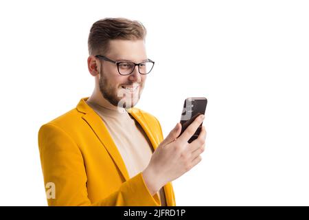 Happy businessman using smartphone Stock Photo