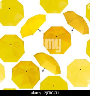 Seamless pattern of different yellow colors umbrellas isolated on white background Stock Photo