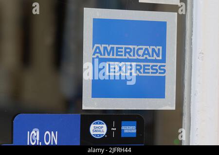 Shop small and American Express cards welcome sign in retail shop