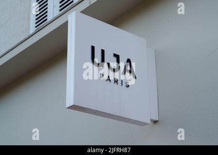 Cannes , paca  France - 06 15 2022 : uja paris brand un jour ailleurs logo and text sign on wall clothing fashion store women girls Stock Photo