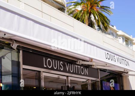 Cannes , paca  France - 06 15 2022 : Louis Vuitton logo sign and brand text shop entrance facade French luxury fashion house store Stock Photo