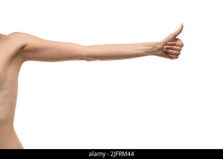 Young woman's stretched skinny arm thumb up. Isolated on blue studio  background Stock Photo - Alamy