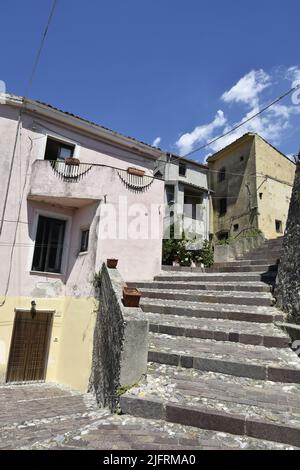 A vertical shot of old stairs in the one of the streets of Altomonte village, Calabria region, Italy Stock Photo