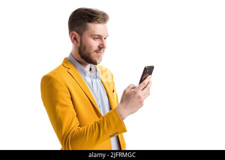 Focused successful male holding smartphone Stock Photo