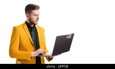 Male standing with wireless laptop Stock Photo