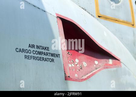 Air intake cargo compartment refrigerator decal on an old aircraft Stock Photo