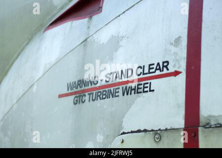 Warning stand clear turbine wheel decal on an old aircraft Stock Photo