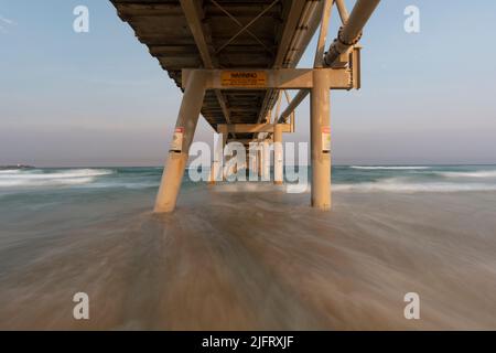 The sand pumping jetty located on The Spit north of Surfers Paradise. Stock Photo