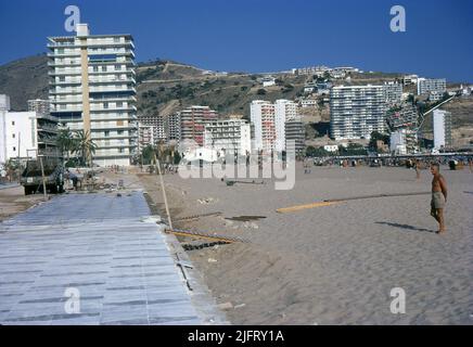 Costa Blanca, Spain. 1970. Construction workers laying a pavement along Playa de Levante, Benidorm. Many hotels and apartments are visible, including Hotel Ancora; Happy Stay Apartments; Hotel Brisa and Las Carabelas Apartments. Stock Photo