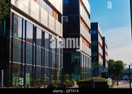 Facade of buiding with green trees, Modern office building in city for business corporation, Residential contemporary Stock Photo
