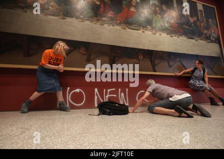 Protesting Last Supper Protesters from Just Stop Oil climate protest group glue their hands to ...