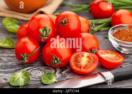sliced cherry tomato on wood background Stock Photo