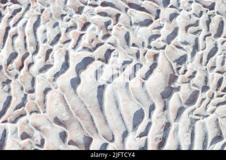Background white - grey texture of Pamukkale calcium travertine in Turkey, abstract pattern, top view. Stock Photo