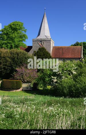 St Andrews church, Alfriston, East Sussex, seen from the garden of the adjacent Clergy House. Stock Photo