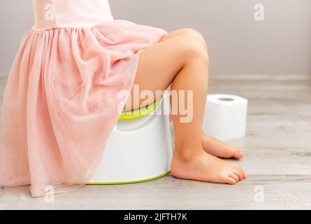 Girl in a potty dress. Stock Photo