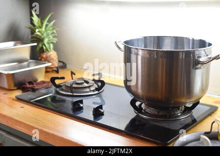 Meatal saucepan on gas stove in the kitchen Stock Photo