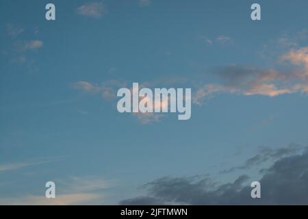Dusk gloomy sky. Gray clouds with day light against blue sky. Dramatic dark clouds sky. Natural scenic view Stock Photo