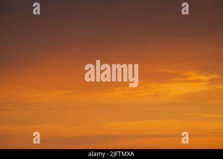 Nature background. Dramatic clouds on the sky in red colors Stock Photo