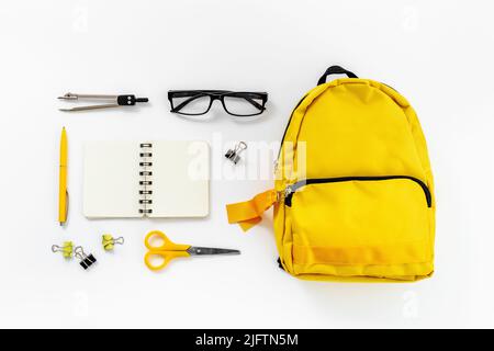 Flat lay of school backpack with school items and student accessories, top view Stock Photo