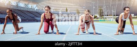 Group of determined female athletes in starting position to begin a sprint or running race on a sports track in a stadium. Focused and diverse women Stock Photo