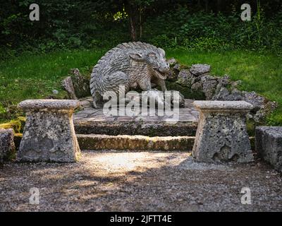 Statue of wild boar with cubs in the Wassespiele Park near Hellbrunn Palace in Austria Stock Photo