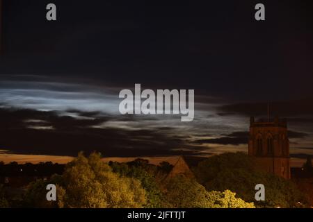 Noctilucent Clouds seen from Newcastle City Centre with Jesmond Parish Church a grade II listed building designed by the famous architect John Dobson in 1861, Newcastle upon Tyne, UK, 5th July, 2022, Credit: DEW/Alamy Live News Stock Photo