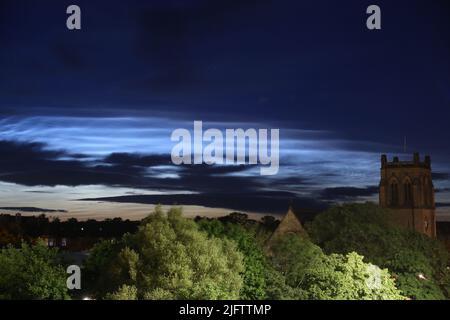 Noctilucent Clouds seen from Newcastle City Centre with Jesmond Parish Church a grade II listed building designed by the famous architect John Dobson in 1861, Newcastle upon Tyne, UK, 5th July, 2022, Credit: DEW/Alamy Live News Stock Photo