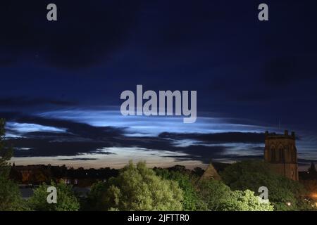 Noctilucent Clouds seen from Newcastle City Centre with Jesmond Parish Church a grade II listed building designed by the famous architect John Dobson in 1861, Newcastle upon Tyne, UK, 5th July, 2022, Credit: DEW/Alamy Live News Stock Photo