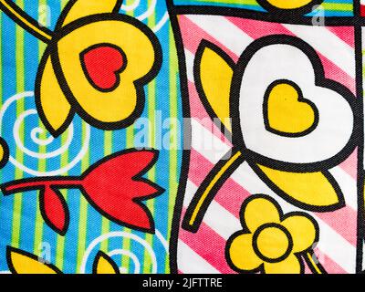 Original fabric background, with drawings of flowers and hearts. Horizontal view. Stock Photo