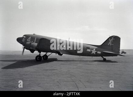 1940s aircraft a Douglas C-47 Skytrain USA military cargo and passenger airplane parked on a Cairo Egypt airfield B&W vintage photo Stock Photo