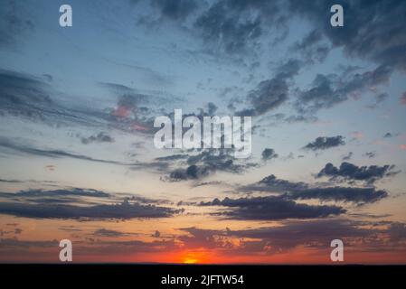 Fantastic soft thunderclouds at sunrise, natural composition Stock Photo