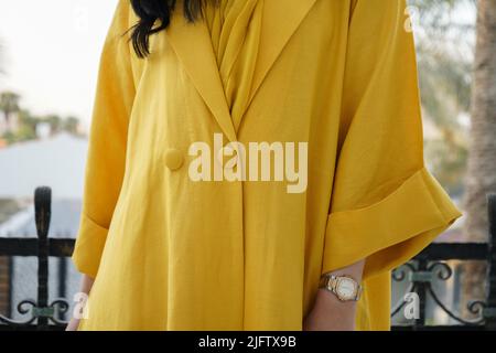 Woman wearing Yellow Abaya, Saudi Abaya Stock Photo
