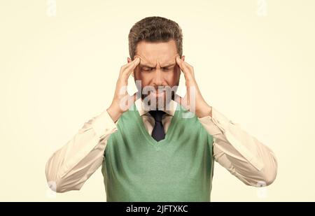 stressed businessman in business casual style having headache isolated on white background, pain Stock Photo
