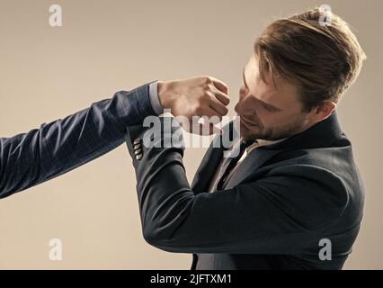 Defending himself from punch to face. Professional man defend punch. Self defence. Physical assault Stock Photo