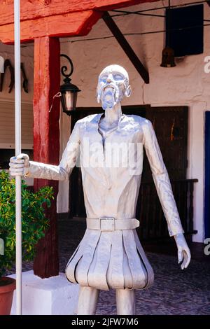 Don Quixote sculpture. Courtyard. Venta del Quijote. Inns are typical buildings of La Mancha, built around a central building, with archades, stables, Stock Photo